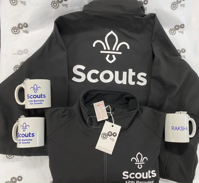 April 2022 2 Black shell jackets with white text and white mugs